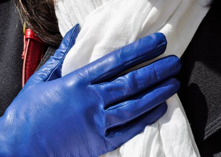 Female blue weather glove and white scarfの写真素材