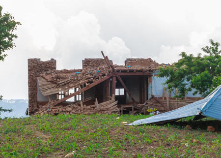 KOT DANDA, LALITPUR, NEPAL - MAY 2, 2015: Damaged house after the 7.8 earthquake that hit Nepal on April 25, 2015.のeditorial素材