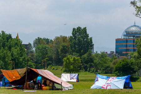 KATHMANDU, NEPAL - MAY 13, 2015: The Nepal Golf Course is used as a makeshift campsite after a 7.3 earthquake hit Nepal on May 12, 2015.のeditorial素材