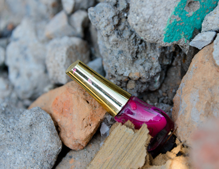 KATHMANDU, NEPAL - MAY 22, 2015: A nail polish pot lies among the rubble after two major earthquakes hit Nepal on April 25 and May 12, 2015.のeditorial素材