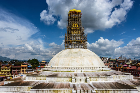 KATHMANDU, NEPAL - 24 JULY, 2015: Bamboo scaffolding is set up on the top of Boudhanath stupa in order to repair the damages caused by the Nepal earthquake of April 25, 2015.のeditorial素材