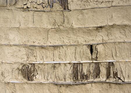 Mud, bamboo and straw wall texture in Nepalの写真素材