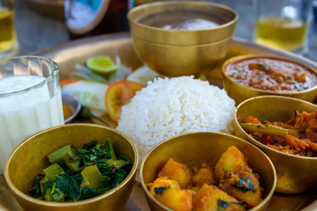 Traditional Nepalese thali in a restaurantの写真素材