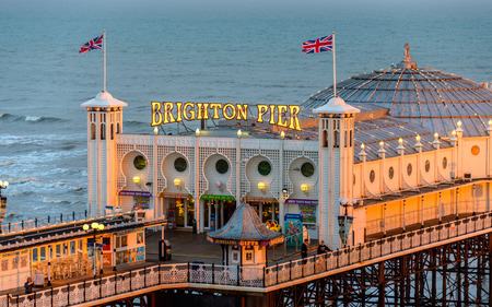 BRIGHTON, UK - CIRCA APRIL 2013: The Brighton Pier at sunset.のeditorial素材