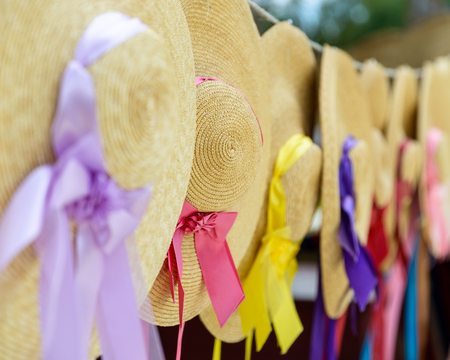 Traditional straw hats with ribbonsの写真素材