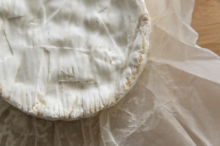 Camembert cheese on a wooden boardの写真素材