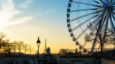The ferris wheel and the Eiffel Tower in Paris, Franceの写真素材