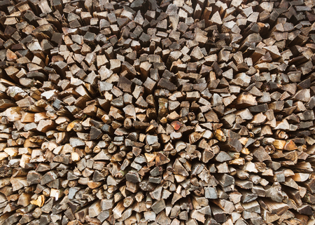 Stack of firewood, chopped firewood background.の写真素材