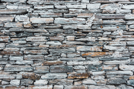 Old grey stone wall textureの写真素材
