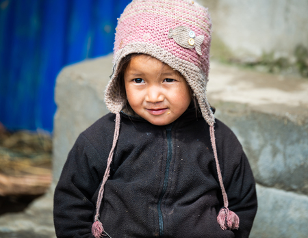 GHALEGAUN, NEPAL - CIRCA MAY 2018: Young Nepali girl wearing a pink cap.のeditorial素材