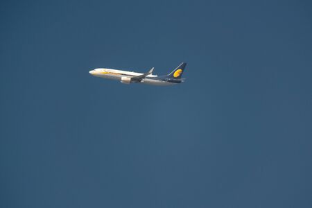 KATHMANDU, NEPAL - CIRCA JANUARY 2019: Jet Airways Boeing 737-85R flies above Kathmandu after taking off from Tribhuvan International Airport.のeditorial素材