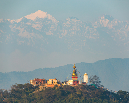 Swayambhunath stupa also called Monkey Temple in Kathmandu, Nepal. In the background the Langtang range, a subrange of the Himalayas.の写真素材