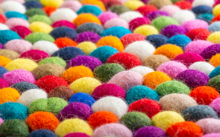 Multicolored felt ball rug detail, colorful textureの写真素材