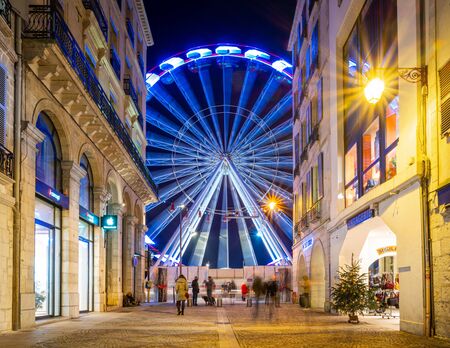BAYONNE, FRANCE - DECEMBER 28, 2019: The ferris wheel as seen from rue Port Neuf at night.のeditorial素材