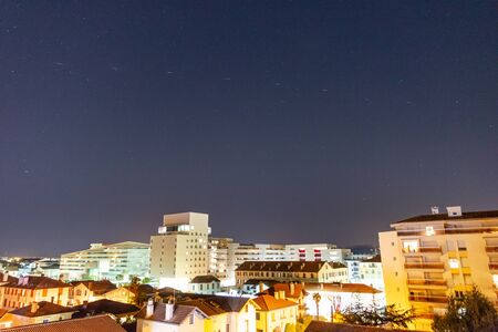 BAYONNE, FRANCE - JANUARY 20, 2020: Time-lapse of SpaceX Starlink satellites in the night sky. The Starlink satellite constellation is under construction and will provide satellite internet access.のeditorial素材