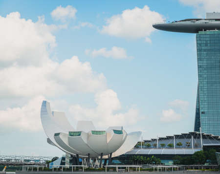 SINGAPORE - CIRCA JANUARY 2016: The ArtScience Museum at Marina Bay. Its architecture is inspired by the shape of a lotus flower. The Marina Bay Sands hotel on the right hand side.のeditorial素材