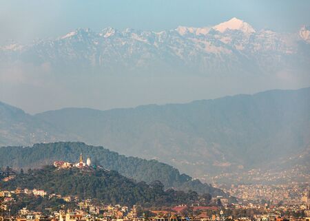 Swayambhunath stupa also called Monkey Temple in Kathmandu, Nepal. In the background the Langtang range, a subrange of the Himalayas.の写真素材