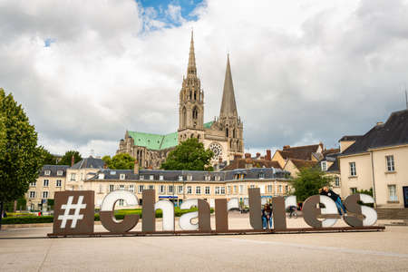 CHARTRES, FRANCE - CIRCA JUNE 2020: Hashtag Chartres sign at Chatelet Square and the cathedral in the background.のeditorial素材