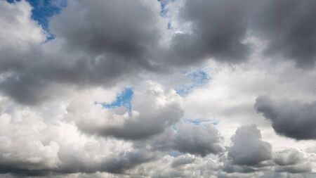 Dramatic dark cloudy sky, bad or rainy weather natural backgroundの写真素材