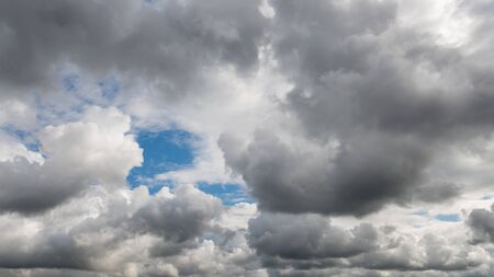 Dramatic dark cloudy sky, bad or rainy weather natural backgroundの写真素材