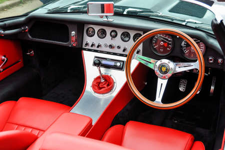 LONDON, UK - CIRCA SEPTEMBER 2011: Eagle E-Type Speedster dashboard, red leather seats. The Eagle E-Type is a restored and modified Jaguar E-Type.のeditorial素材