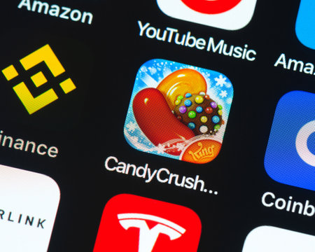 BAYONNE, FRANCE - CIRCA JANUARY 2021: Candy Crush Saga app icon on Apple iPhone screen. Candy Crush Saga is a free puzzle video game.のeditorial素材