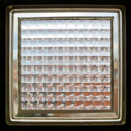 Closeup shot of a glass brick also known as glass block texture, abstract background, square crop