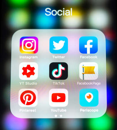 BAYONNE, FRANCE - CIRCA FEBRUARY 2021: Social media app icons in folder on iPhone screen.のeditorial素材