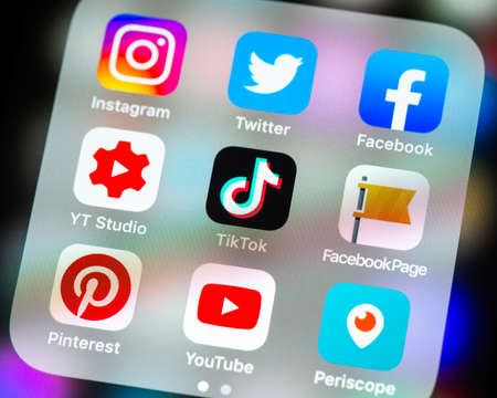 BAYONNE, FRANCE - CIRCA FEBRUARY 2021: Social media app icons in folder on iPhone screen.のeditorial素材