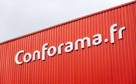 ANGLET, FRANCE - CIRCA FEBRUARY 2021: Conforama sign on red store facade. Conforama is a French home furnishings retail chain.のeditorial素材