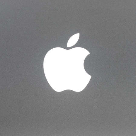 BAYONNE, FRANCE - CIRCA JANUARY 2021: Macro shot of MacBook Pro backlit Apple logo, brushed aluminium texture.のeditorial素材