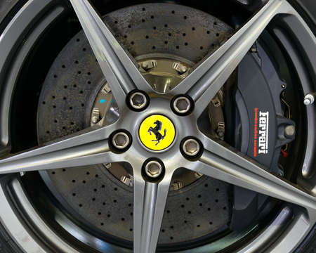 LONDON, UK - CIRCA JULY 2013: Ferrari F12 Berlinetta wheel with Brembo carbon ceramic disk brake.のeditorial素材