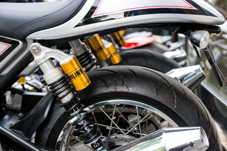 PARIS, FRANCE - CIRCA MAY 2013: Ohlins shock absorbers, motorcycle rear suspsension detail.のeditorial素材