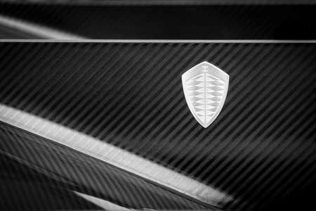 LONDON, UK - CIRCA JUNE 2014: Koenigsegg logo on One:1 carbon fiber bodywork, black and white photography.のeditorial素材