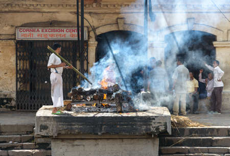 KATHMANDU, NEPAL - CIRCA AUGUST 2014: Creamation at Pashupatinath on the bank of the Bagmati river.のeditorial素材