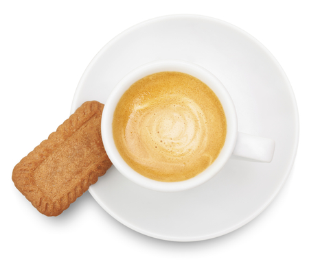 Espresso coffee cup with cinnamon cookie isolated on white background photographed from above.の写真素材