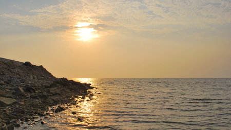 A calm sunset over the untouched coast of Hai Tac Island, Ha Tien, Kien Giang, Vietnam â a hidden tropical escape with quiet charm.の写真素材