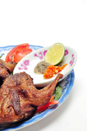 Vietnamese grilled quail on a white backgroundの写真素材