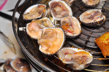 Shell steaks on the grillの写真素材