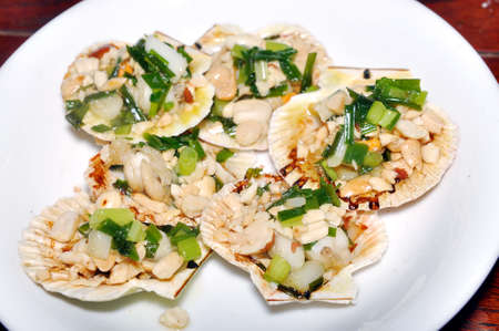 Grilled scallops steaks on the white dishの写真素材