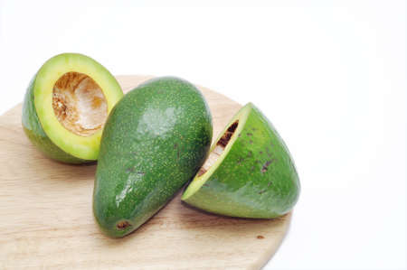 Avocado on the cutting board  in a white backgroundの写真素材