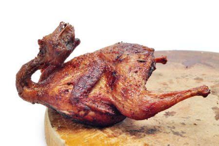 Vietnamese grilled quail on a white backgroundの写真素材