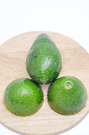 Avocado on the cutting board  in a white backgroundの写真素材