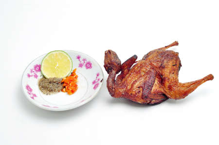 Vietnamese grilled quail on a white backgroundの写真素材
