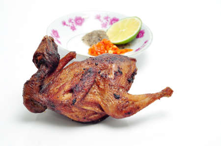 Vietnamese grilled quail on a white backgroundの写真素材