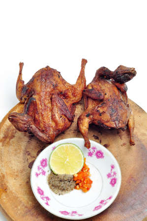 Vietnamese grilled quail on a white backgroundの写真素材