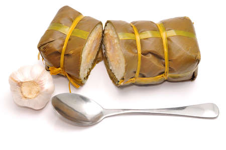 Vietnamese Cylindrical Sticky Rice Cake or Banh Tet on a white backgroundの写真素材