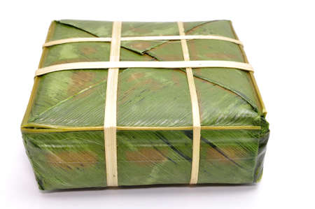 stuffed sticky rice cake or Banh Chung on a white backgroundの写真素材