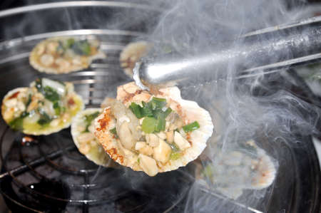 Shell steaks on the grillの写真素材