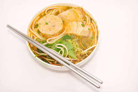 Bun bo or Vietnamese vermicelli noodles with beef on a white backgroundの写真素材
